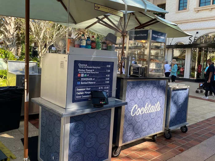 You can find food carts that sell items like Disney World churros and Mickey-shaped pretzels throughout the shopping center.