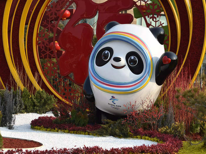 Bing Dwen Dwen is a panda with a full-body "shell" of ice that resembles an astronaut