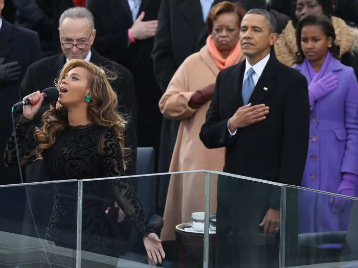 Beyoncé wore a black, form-fitting dress with sheer lace sleeves for Obama