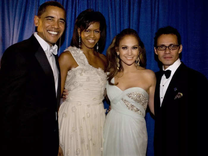 Jennifer Lopez and Marc Anthony wore evening wear while posing with the Obamas in 2009. Lopez wore a single-strap dress with gold details, and Anthony stuck with a classic suit.