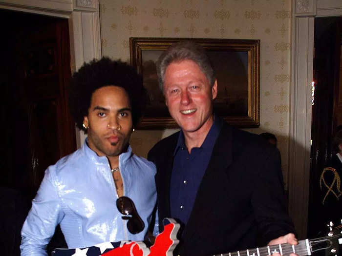 Lenny Kravitz also went casual that day. He wore a shiny blue shirt with jeans that were ripped and studded to meet the then-president.