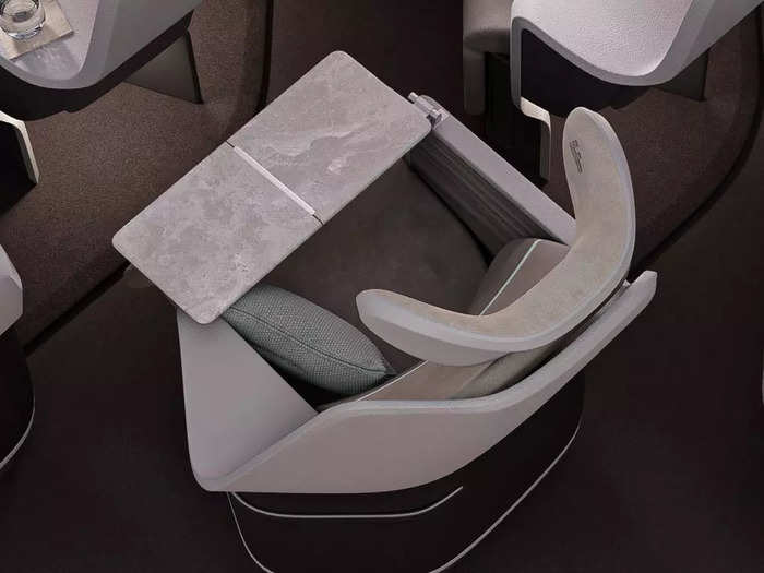 Unlike the original ACCESS, the HD version offers in-arm tray tables...