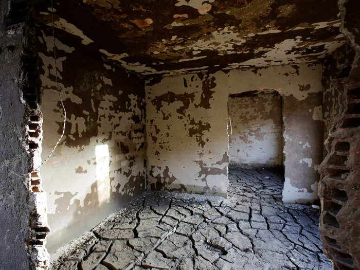 The ruins of Aceredo village include partially destroyed buildings and lots of loose debris.