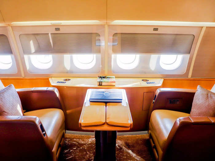 Opposite the couch is a simple pair of club seats separated by a table. This type of setup can be found on nearly every private jet.