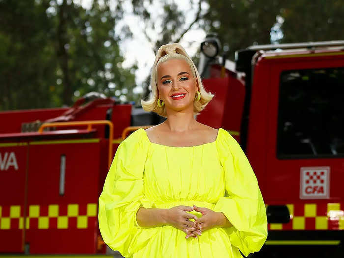 Katy Perry put a bright twist on maternity fashion with a neon minidress in March 2020.