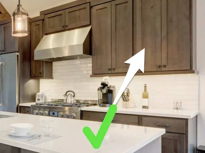 Unpainted kitchen cabinets are trending.