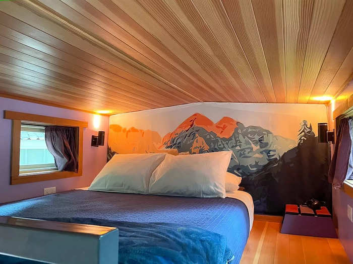 Inside the 170-square-foot Rocky Mountain High house, a colorful mural of the Rocky Mountains covers a wall in the loft.
