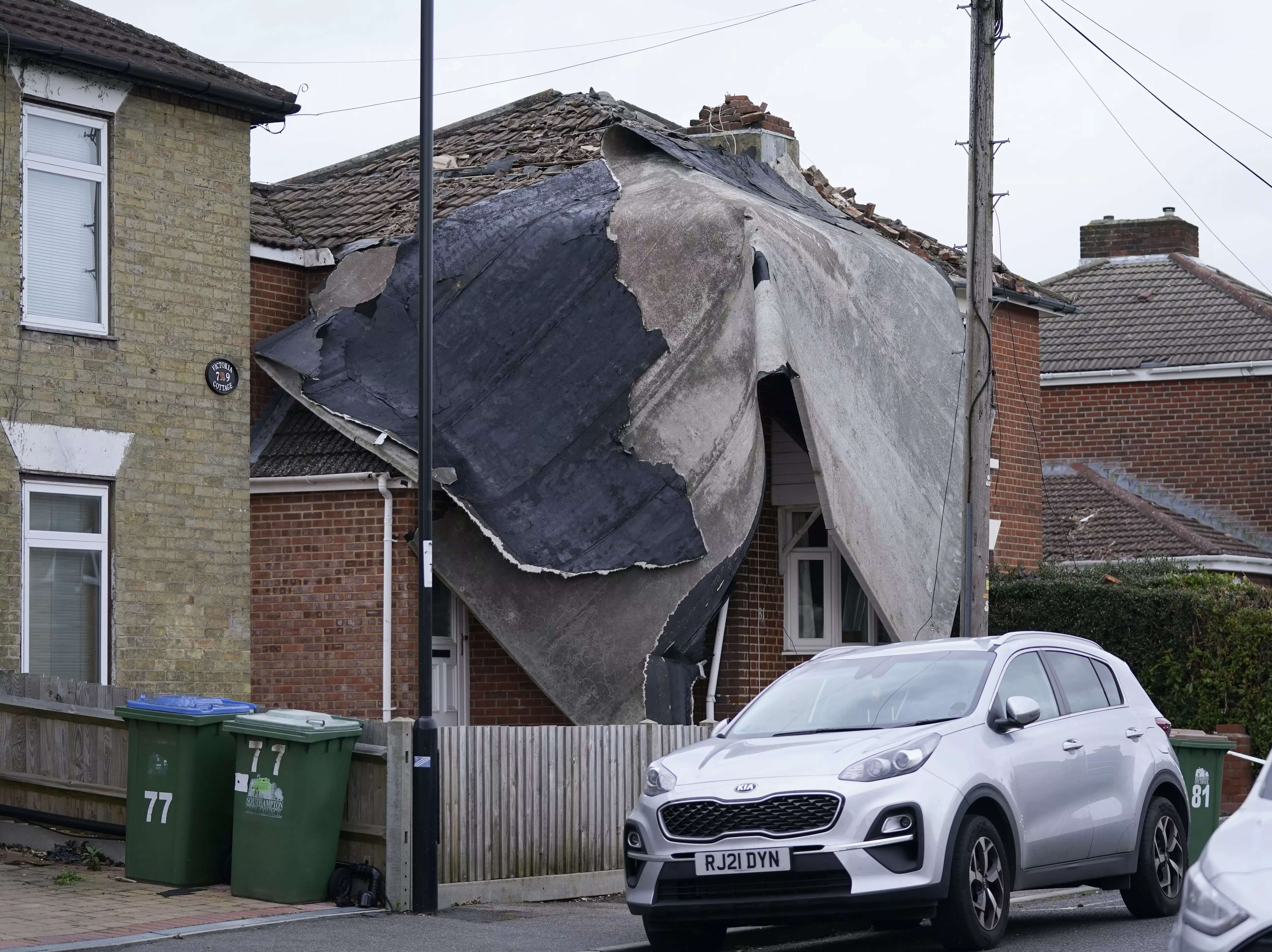 A view of part of a flat roof from a nearby block of flats which was blown off and landed on a house in Bitterne, Southampton, as Storm Eunice brought damage, disruption and record-breaking gusts of wind to the UK.