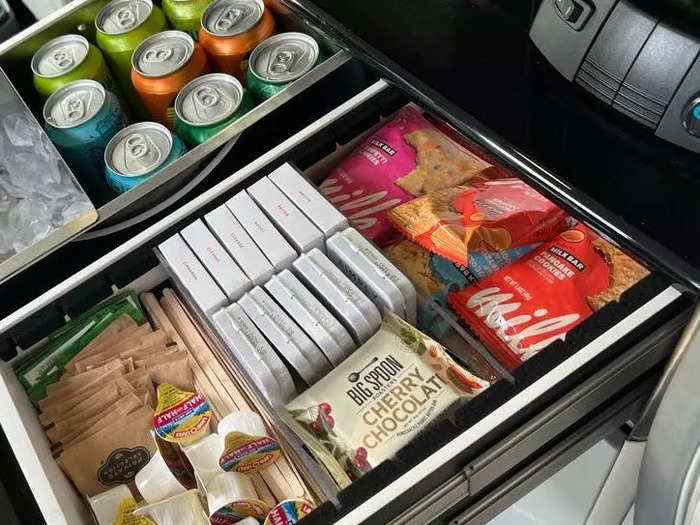 The galley was stocked with a variety of snacks and drinks, like cookies, soda, and alcohol.