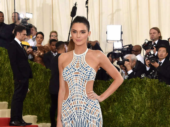 Kendall Jenner wore a bold gown with a mosaic-style pattern and side cutouts to the 2016 Met Gala.