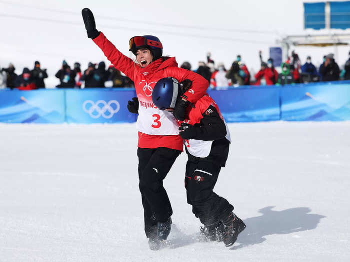 2/15: Gold medalist Mathilde Gremaud (right) of Team Switzerland and silver medalist Eileen Gu of Team China react after placing first and second in the Slopestyle Final on Day 11 of the Beijing Olympics.