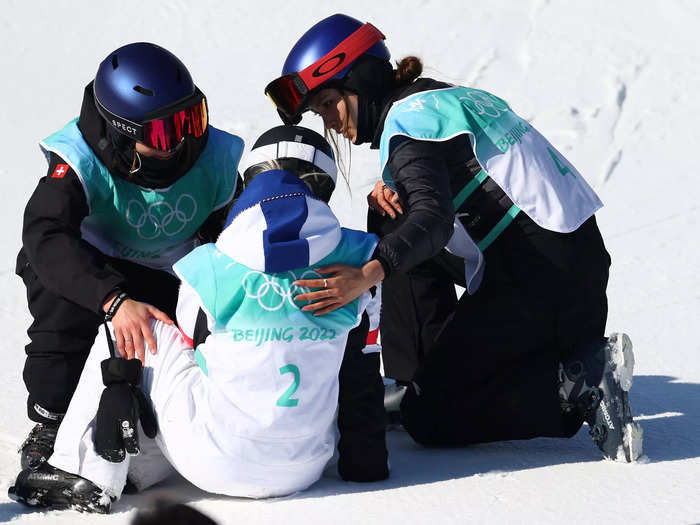 2/8: Eileen Gu (right) joins Big Air bronze medalist Mathilde Gremaud (left) of Team Switzerland to console silver medalist Tess Ledeux of Team France during the Big Air final on Day 4 of the Beijing Olympics.