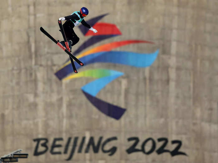 2/6: Eileen Gu performs a trick in front of the Beijing 2022 logo during a Big Air training session on Day 2 of the Olympics.