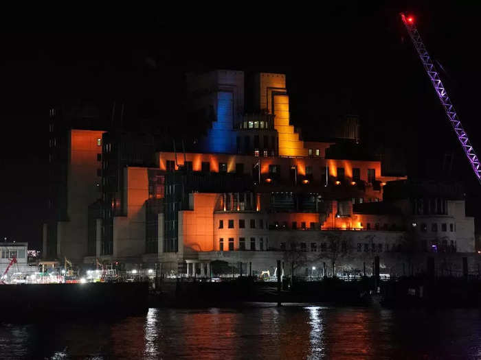 The SIS Building, also known as the MI6 building, in London featured a blue and yellow lighting display.