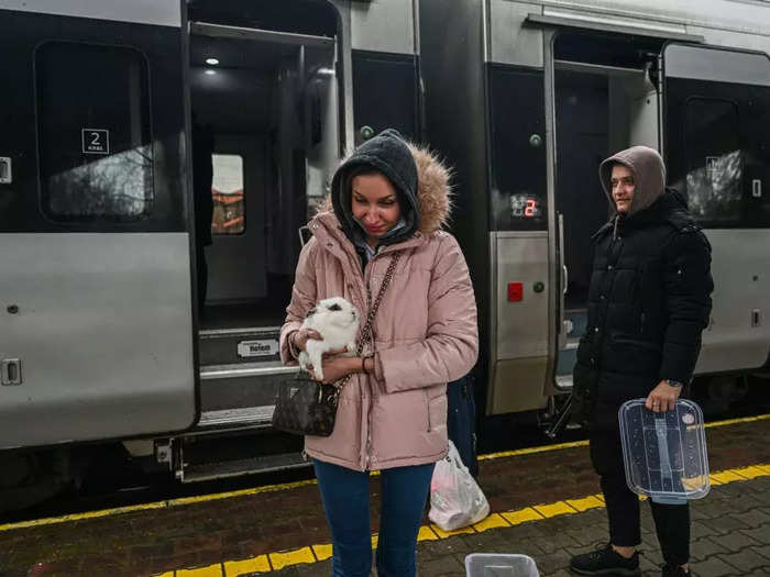 At Przemysl train station in Poland, a woman carried her pet rabbit as she stepped off a train from Kyiv.