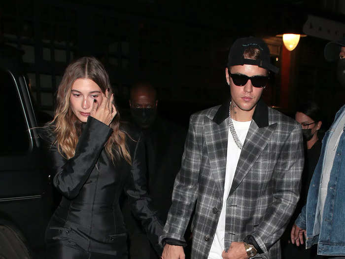 In December 2021, Justin explored a new look with a gray plaid suit, while Hailey wore an all-black outfit.