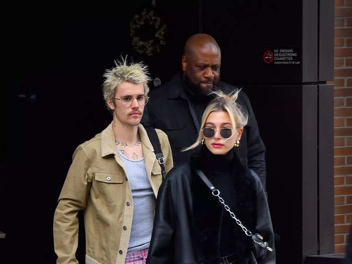 Hailey took her "Matrix" look one step further by adding leather pants and a black turtleneck to her ensemble. Justin, on the other hand, went for plaid pajama pants, slides, and a tan shacket.