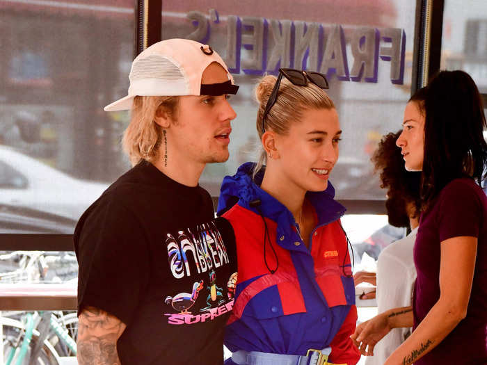 Two weeks later, Hailey wore a unique belted windbreaker mini dress, while her then-boyfriend went for a simple T-shirt (and another hat).