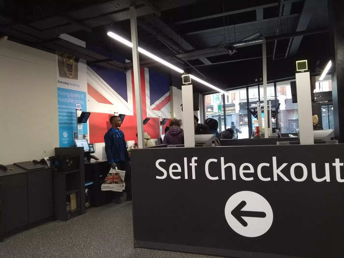 Though there were a few staffed checkouts available, the store was dominated by self-service ones. The area was decorated with a huge print of a Union Jack.