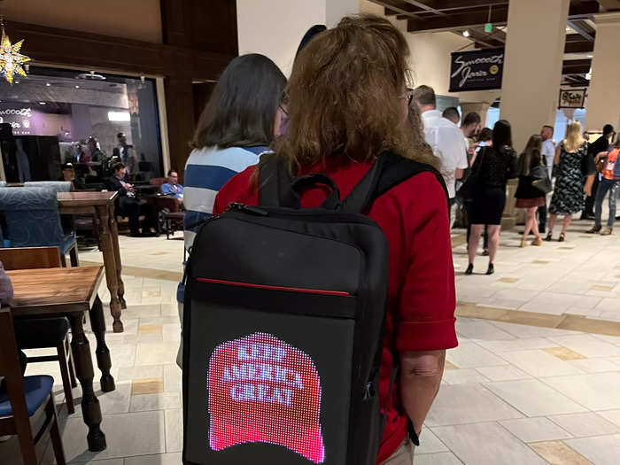 One attendee had a digital screen on their backpack that played MAGA and CPAC images on a never-ending loop.