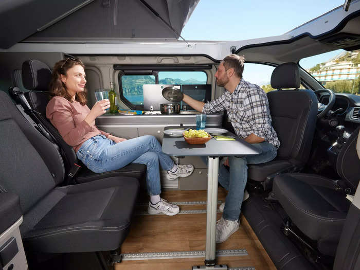 The interior is also lined with camper van basics like a removable table.