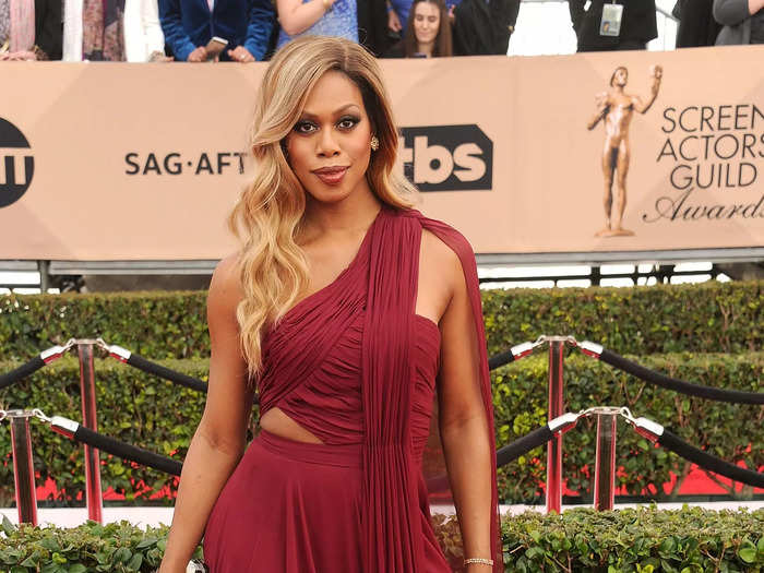 Laverne Cox wore a burgundy dress that showed off her stunning figure at the 2016 awards show.