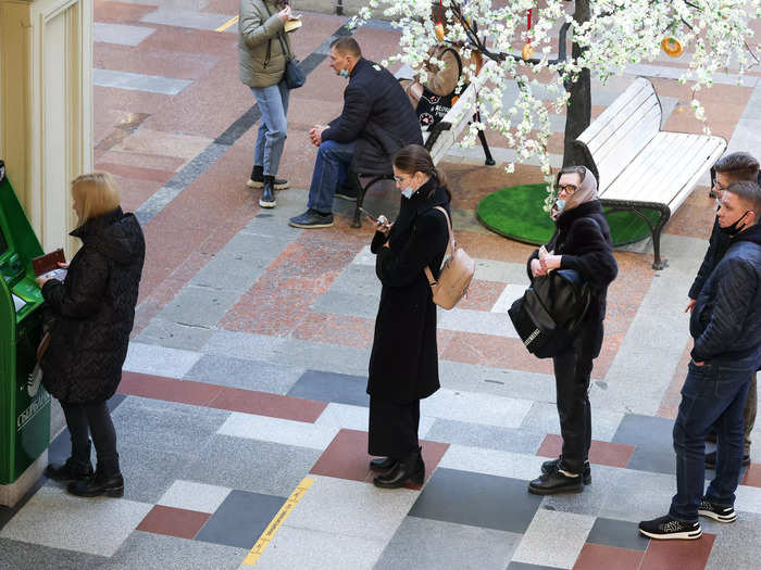 People in Russia are queuing to withdraw foreign currency from ATMs after Russia