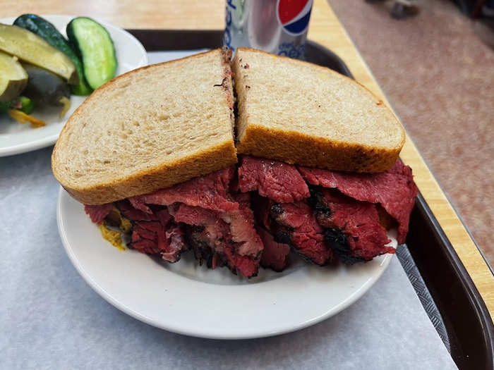 I was given my sandwich and a side of free pickles on a tray.