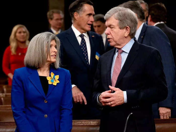 Senator Joni Ernst of Iowa added a blue and yellow flower pin to her blue jacket.