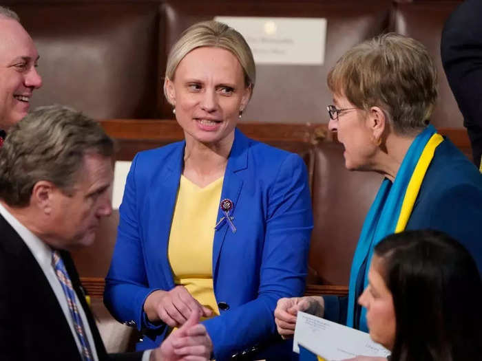 Rep. Victoria Spartz of Indiana, who was born in Ukraine, wore a blue blazer over a yellow dress.