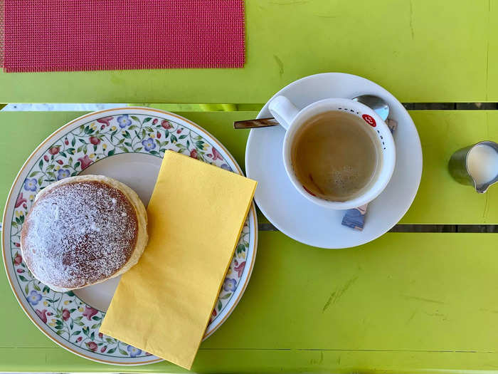 I brought my donut and coffee to the terrace, where I met and spoke with a local woman.