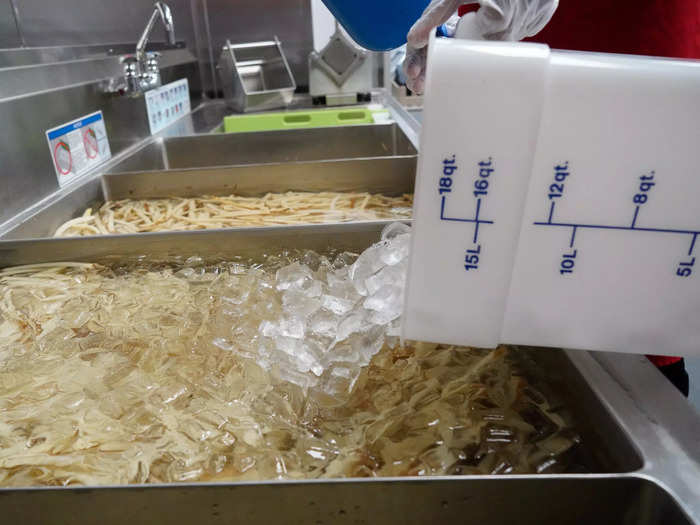 A cold-water soak is crucial to keeping the potatoes ready for frying.