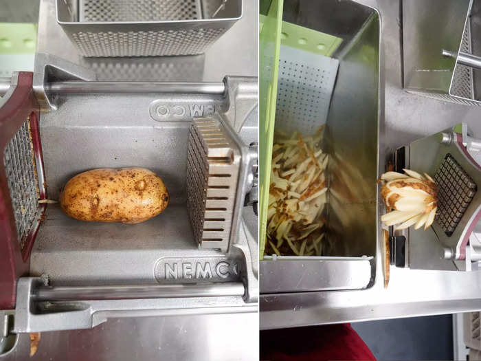 Once the spuds are clean, a team member pushes them through the cutting device one by one to get that iconic shape.