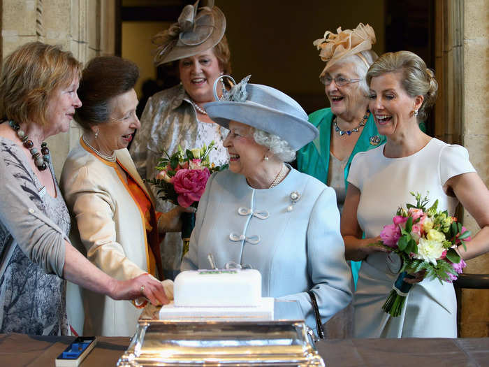 Royal photographer Chris Jackson captured the moment a knife got stuck in a cake that Queen Elizabeth was cutting, causing the royals to burst out laughing.