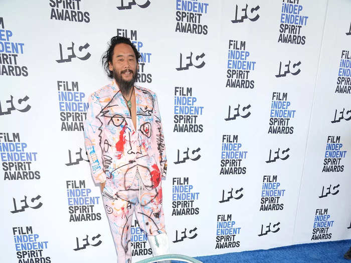 Artist David Choe arrived in an illustrated suit, which he paired with one shoe that extended into a snake-like hoop around him.