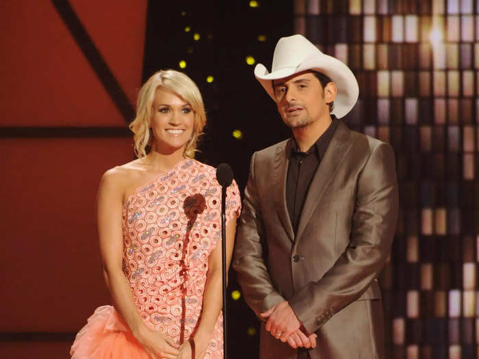 Underwood and Paisley hosted the CMAs again in November 2011 — one bold look she wore on the night was this asymmetrical peach gown with lots of tulle.