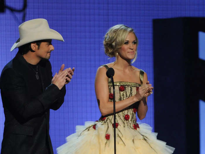 She hosted the evening with Brad Paisley. One of her many costume changes was this dreamy princess tea-length gown covered in roses.