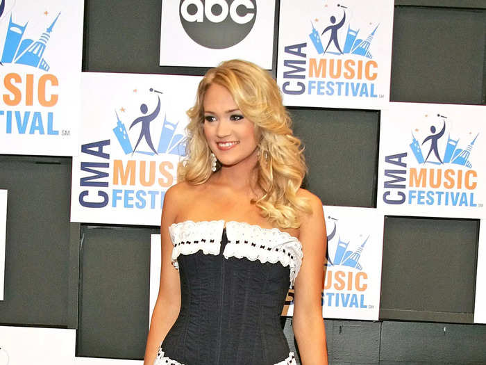 At the 2006 CMA Music Festival in June, Underwood paired pinstripe shorts with a denim corset top and cowboy boots.