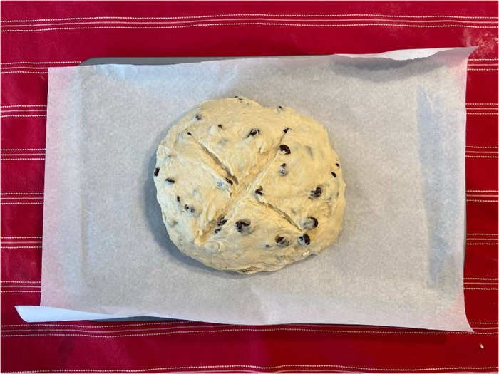 I cut a cross onto the loaf and baked it for the recommended 55 minutes, filling my house with a comforting, fruity smell.