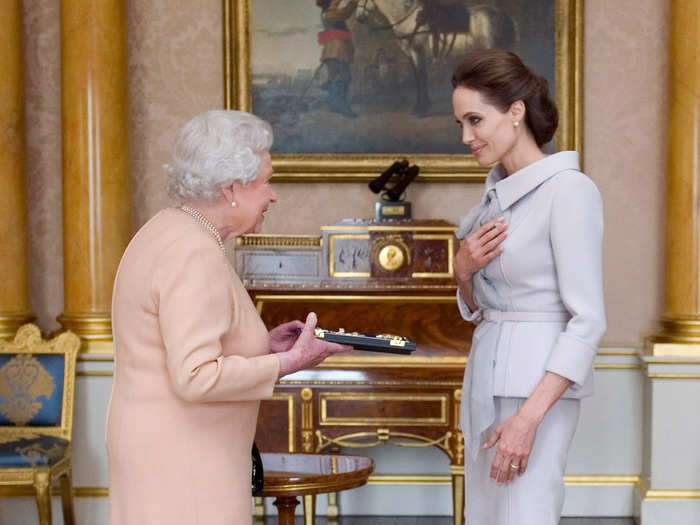 Angelina Jolie received an honorary damehood from Queen Elizabeth for her work to end war-zone sexual violence in 2014.