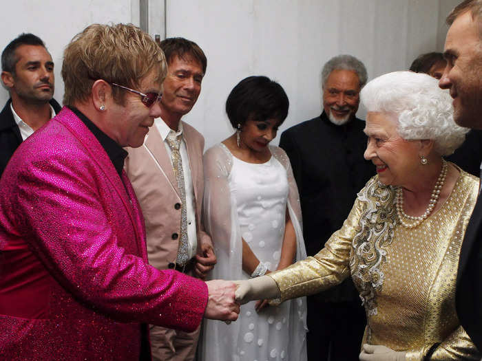 Queen Elizabeth shook hands with Sir Elton John at a 2012 concert in honor of her diamond jubilee.