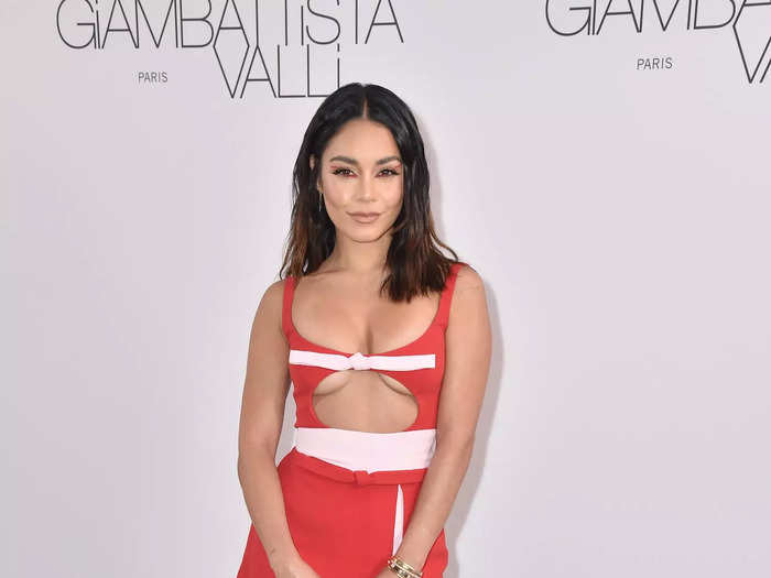She then attended a Giambattista Valli show in a red sleeveless dress with a scoop neckline, a circle cutout across her chest, and a miniskirt with a short slit on the side.