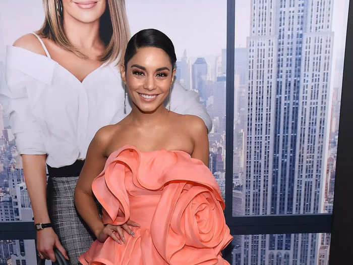 She experimented with bold florals again in December 2018. She wore a coral, strapless minidress with a giant rose at her waist.