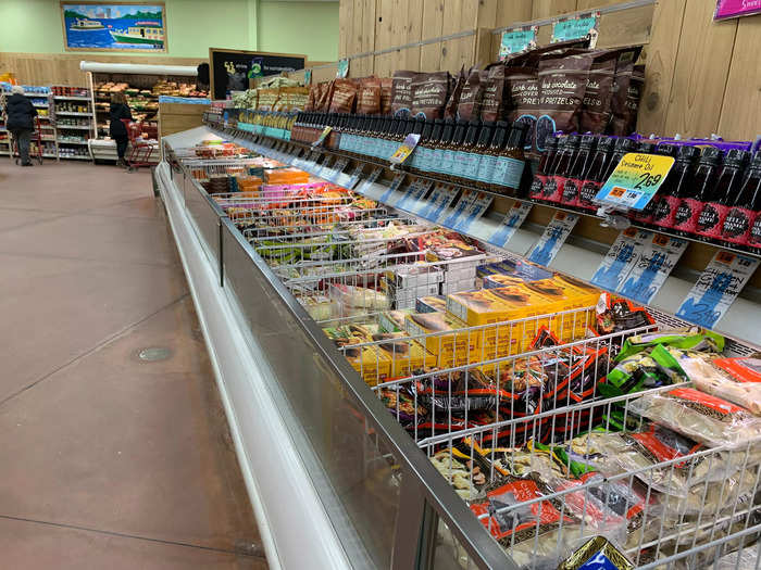 The aisles showcase frozen appetizers, meals, and desserts, divided by type of cuisine.