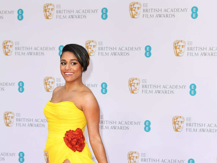 Ariana DeBose shocked the red carpet in a bright yellow gown with a high slit.