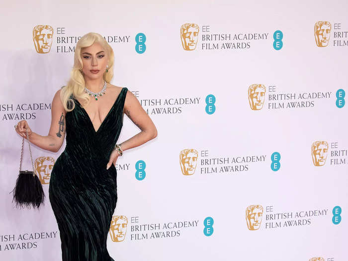 Lady Gaga stunned in a plunging green gown and sky-high platform heels.