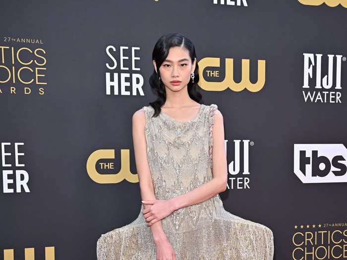 Jung Ho-yeon wore a bedazzled gold Louis Vuitton design with an exaggerated bustle detail.