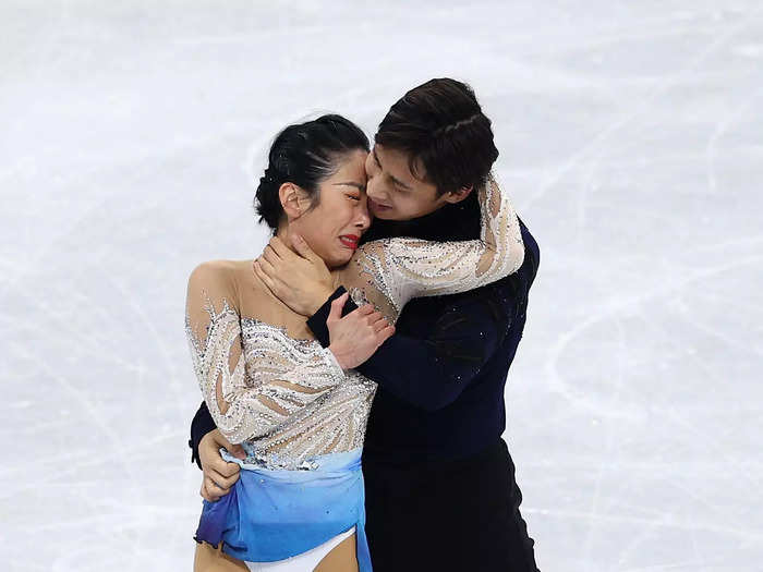 2/19: Wenjing Sui and Cong Han of Team China react after skating during the Pairs Free Skate at the Beijing Olympics.