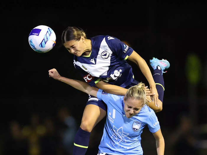 2/16: Kyra Cooney-Cross of the Melbourne Victory heads the ball over Mackenzie Hawkesby of Sydney FC during an A-League Women