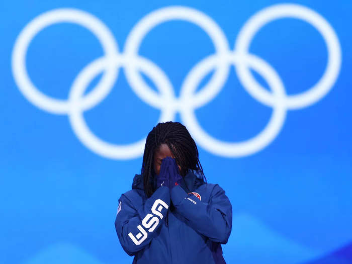 2/14: American speed skater Erin Jackson cries before receiving her gold medal on the podium at the Beijing Olympics.